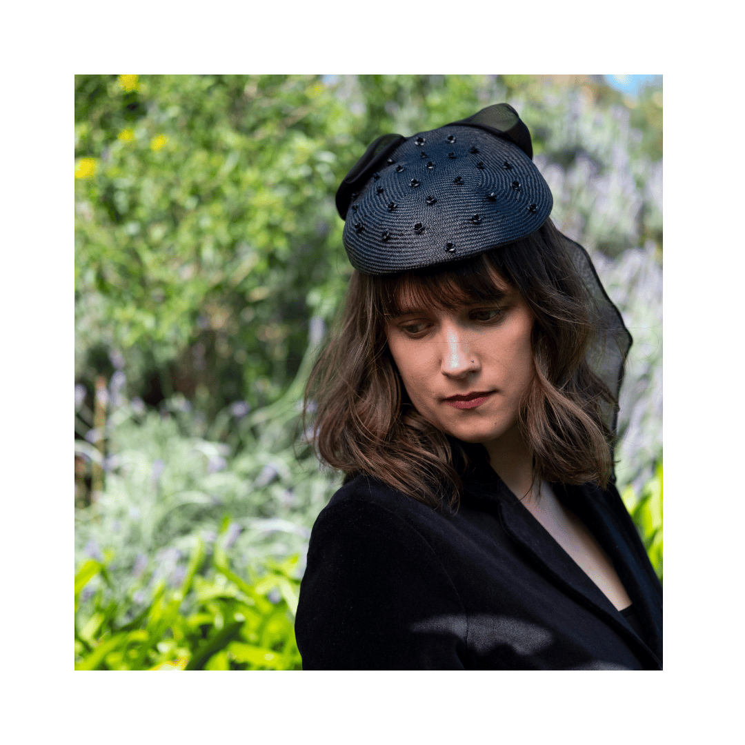 Black cocktail shape with miniature roses and bow