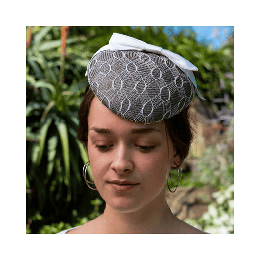 Steel-grey beret with vintage veiling overlay and tailored bow
