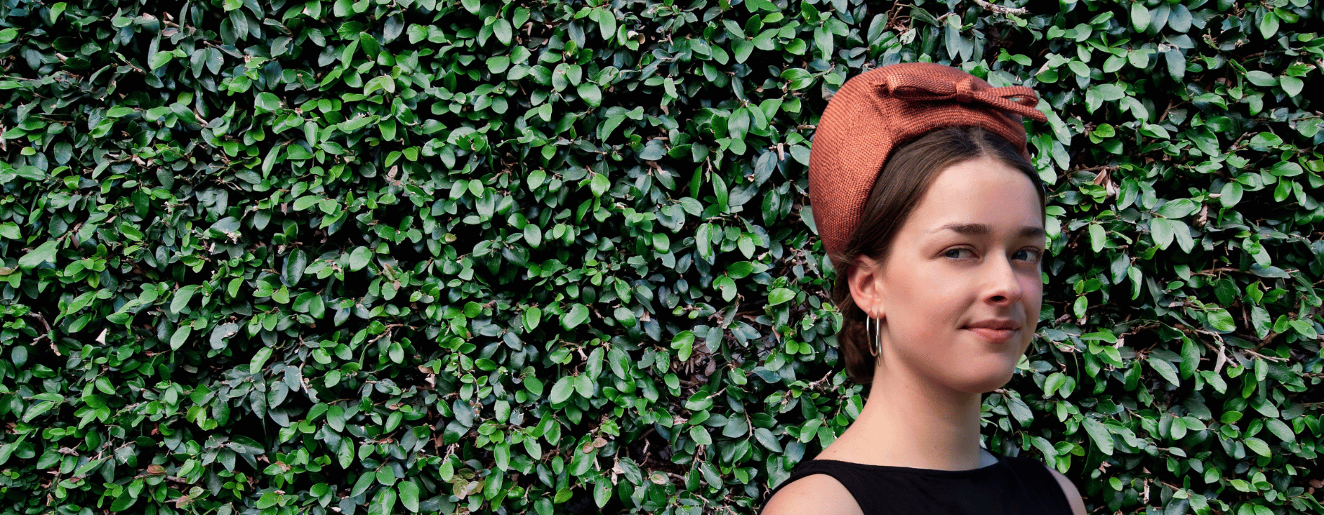 Model wearing a bronze turban by Jo Ramsay Millinery